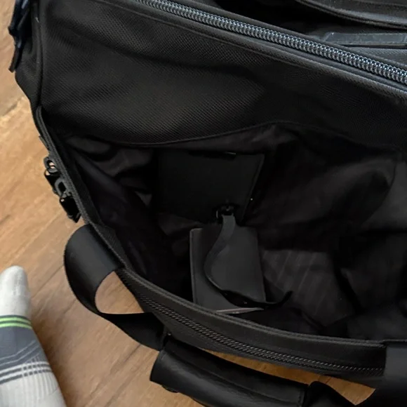 Tumi black travel bag/carryon